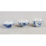 Three small Chinese blue and white porcelain bowls, one decorated with finger citrus, pomegranates