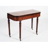 A George III mahogany and ebony lined tea table, the rounded rectangular top above a blind frieze