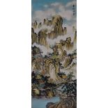 A Chinese silkwork panel, 20th century, decorated with pavilions and figures in a mountain