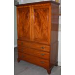 A 19th century mahogany linen press, the moulded cornice and dentil frieze above a pair of