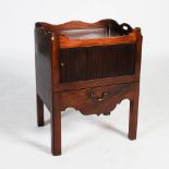 A George III style mahogany tray top commode, the rectangular top with three quarter gallery and two