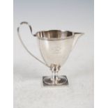 A George III silver cream jug, London, 1792, makers mark TH, the tapered cylindrical bowl with a