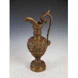 A late 19th/early 20th century bronze ewer, cast with fruiting vine and putti, 51cm high.