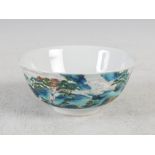 A Chinese porcelain footed bowl, Qianlong seal mark but later, decorated with pavilions and