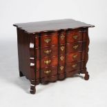 A 19th century Padouk Colonial chest, the shaped rectangular top with a wavy edge above four long