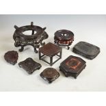 A collection of eight assorted hardwood stands, Qing Dynasty and later, comprising; a square