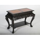 A Chinese dark wood and burr walnut side table, late Qing Dynasty, the rectangular top with two burr