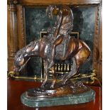 After Remington - A bronze figure of Indian on horseback, on green marble oval shaped stepped