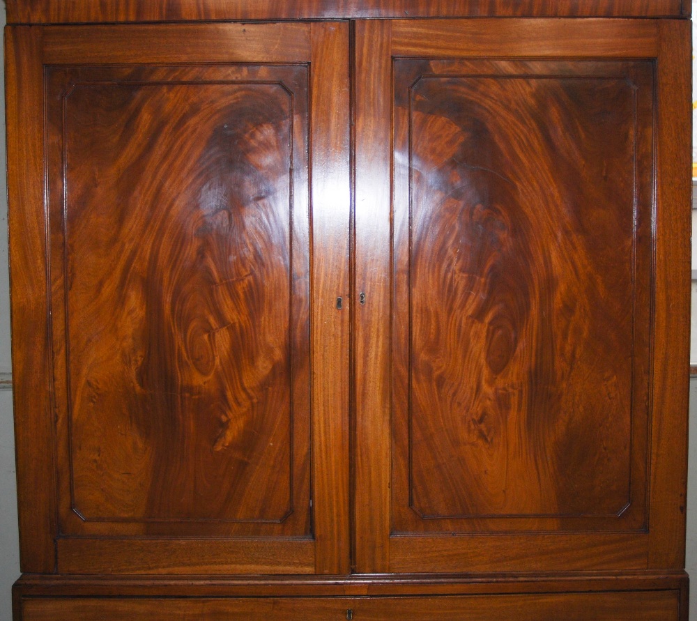 A 19th century mahogany linen press, the moulded cornice and dentil frieze above a pair of - Image 4 of 7