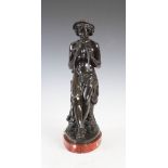 After Jacques Antoine Theodore Coinchon, a bronze figure of boy playing pipes, on mottled white