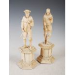 A pair of 19th century European ivory figures of hunters, naturalistically carved standing on