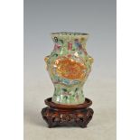 A Chinese porcelain celadon ground famille rose vase , Qing Dynasty,