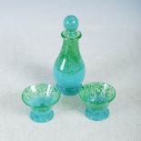 An Ysart glass liqueur decanter and stopper with two matching glasses, mottled green and blue glass,