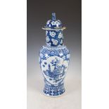 A large Chinese porcelain blue and white vase and cover, decorated with oval shaped panels enclosing