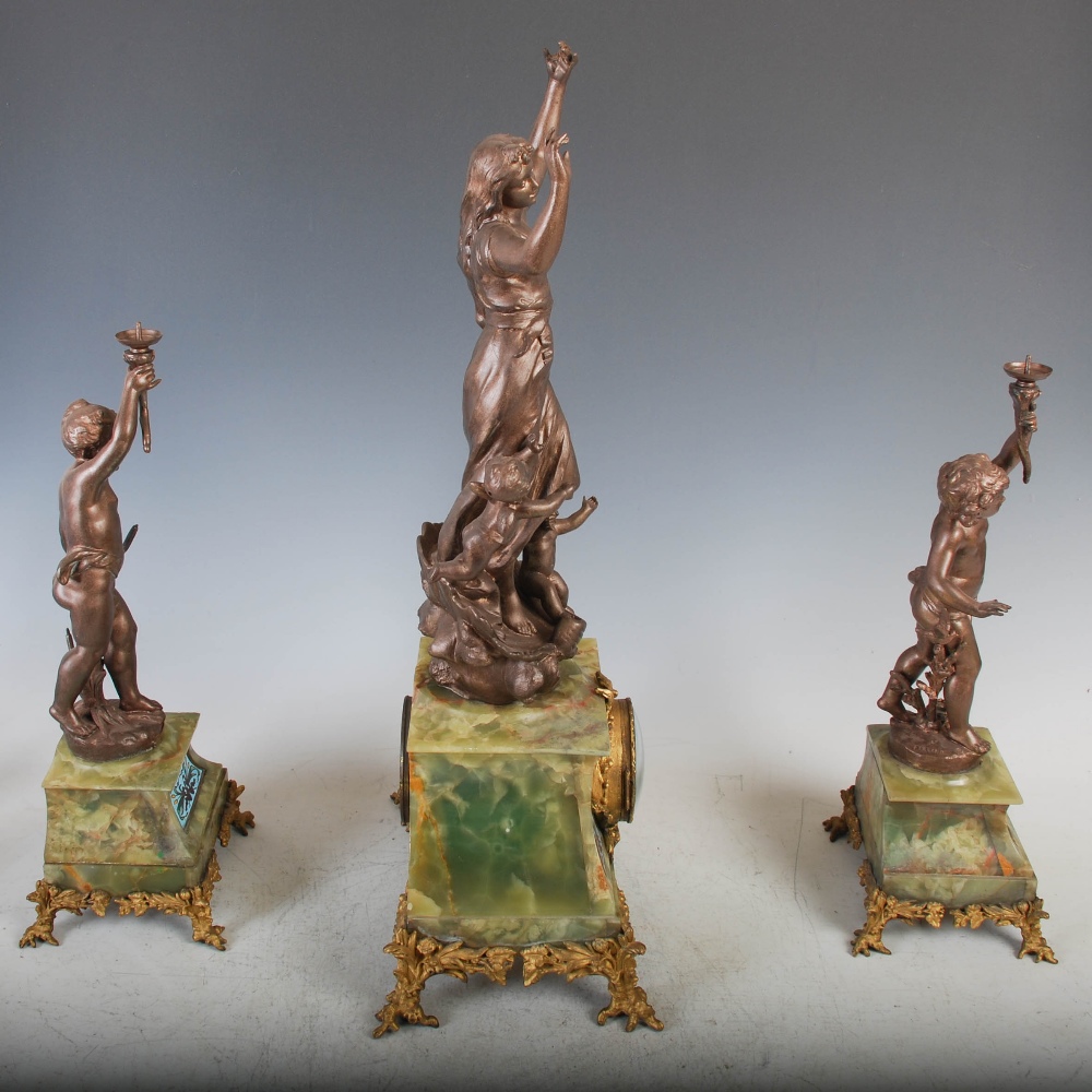 A late 19th/ early 20th century spelter, onyx and champleve enamel clock garniture, the clock with - Image 4 of 20