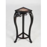 A Chinese dark wood corner jardiniere stand, Qing Dynasty, the triangular shaped top with a