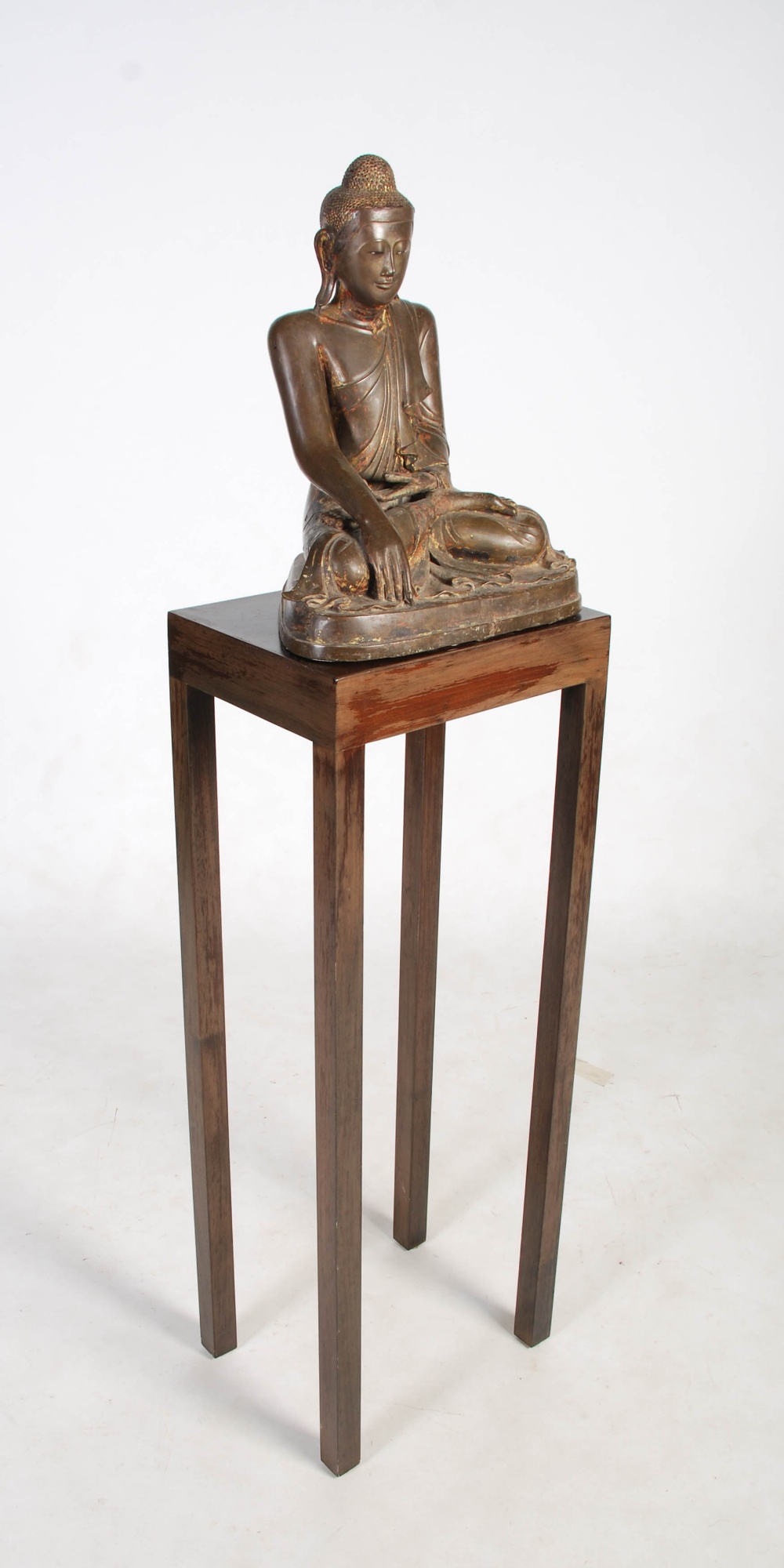 A 19th century gilt bronze figure of Buddha, Mandalay Period, modelled in varjrasana, on later