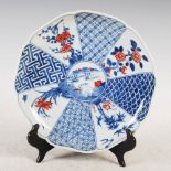 A Chinese porcelain blue, white and copper red octagonal shaped plate, 20th century bearing six