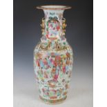 A large Chinese porcelain famille rose Canton vase, Qing Dynasty, decorated with panels of court