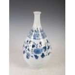 A Chinese porcelain blue and white pear shaped vase, decorated with a band of stylised chrysanthemum