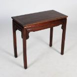 A Chinese dark wood rectangular table, late Qing Dynasty, the panelled rectangular top above a plain