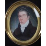 A late 18th/ 19th century portrait miniature of a Gentleman, painted on oval shaped ivory panel,