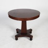 A 19th century mahogany centre table of small proportions, the circular top and plain frieze