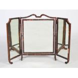 An early 20th century tortoiseshell and ivory strung triple plate dressing table mirror, the central