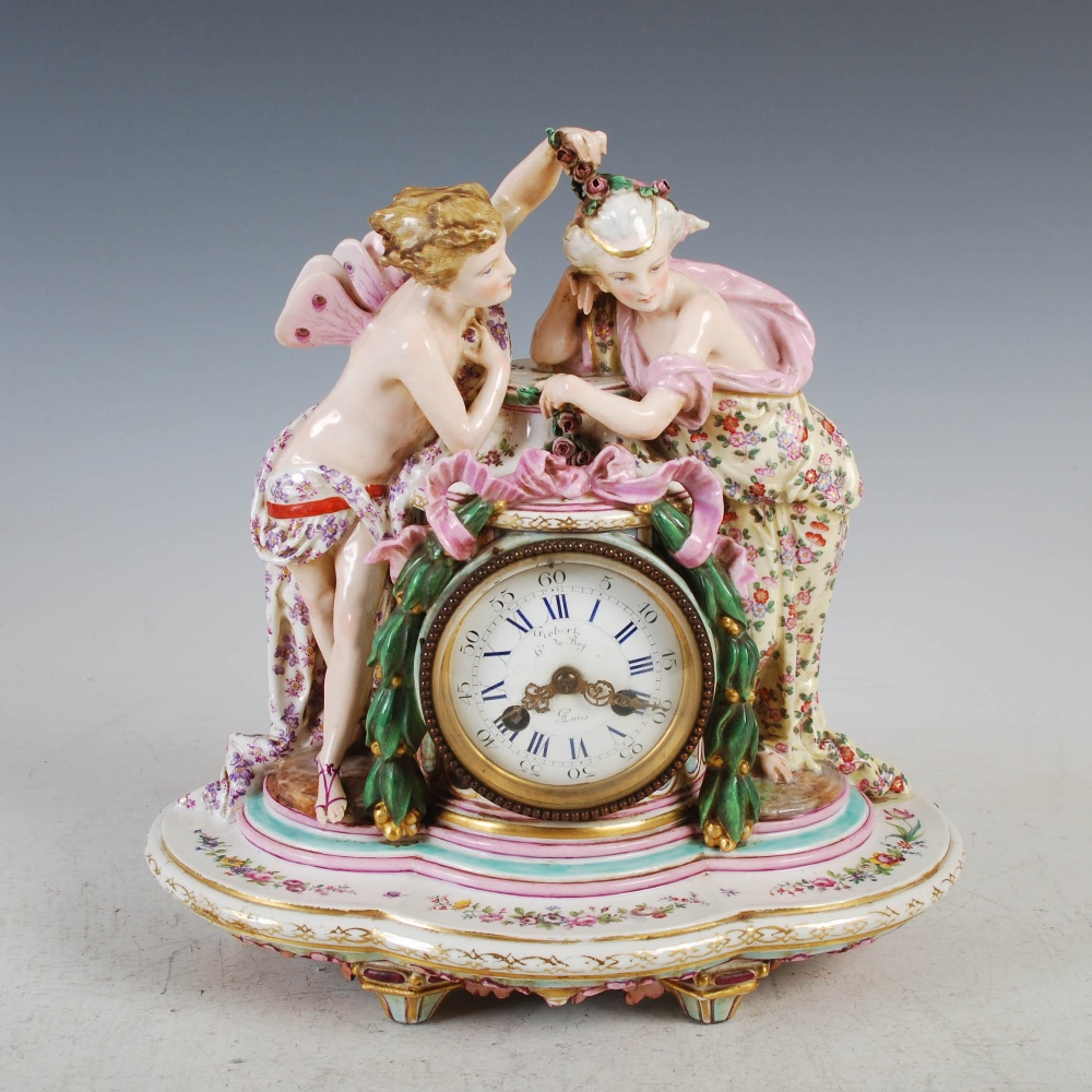 Robert, Paris, a late 19th century Dresden porcelain mantel clock, the circular enamelled dial