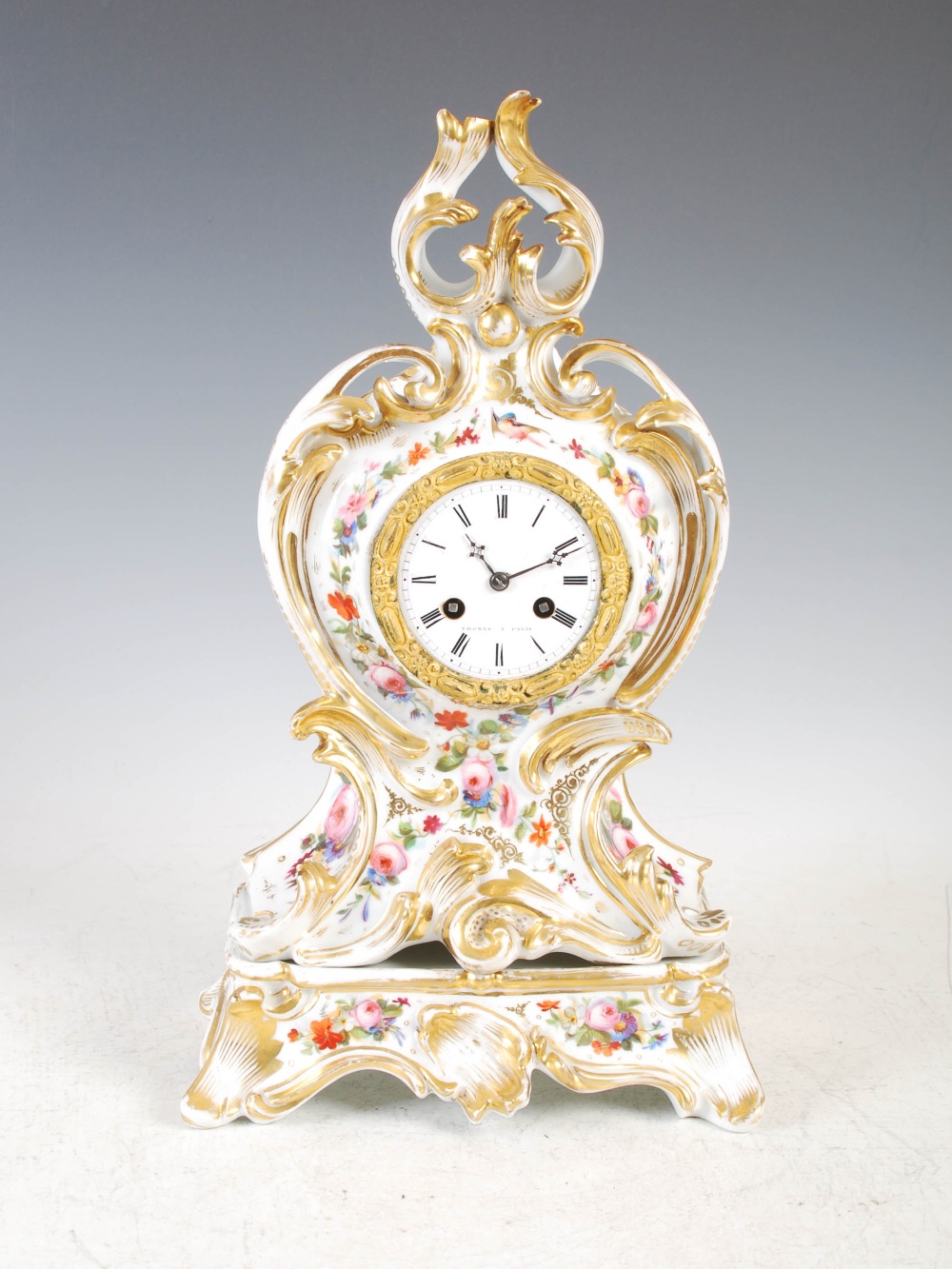 Thomas, Paris, a 19th century Paris porcelain and ormolu mounted Rococo style mantel clock on stand,