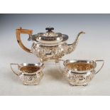 An Edwardian silver three piece tea set, Birmingham, 1902, makers mark of J.G, with embossed foliate