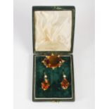 A late 19th century yellow metal mounted Cairngorm citrine and pearl set brooch and matching