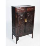 A Chinese dark wood side cabinet, late 19th/early 20th century, the frieze set with two drawers