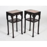 A pair of Chinese dark wood jardiniere stands, Qing Dynasty, the rectangular tops with mottled red