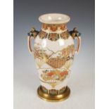 A gilt metal mounted Japanese Satsuma pottery twin handled vase, Meiji Period, decorated with fan