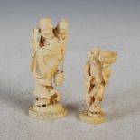 Two Japanese ivory okimonos, Meiji Period, the larger okimono carved with grandfather and boy,