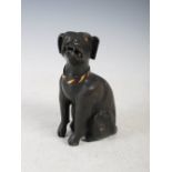 A Japanese bronze model of a sitting dog, 19th century, with incised fur detail, gilded eyes and