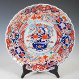 A Japanese Imari porcelain charger, late 19th/early 20th century, decorated with circular shaped