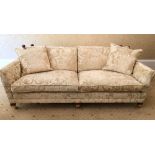 A modern Duresta Trafalgar drop end sofa, with loose cushions, on square section supports with brass