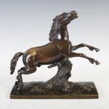 A bronze figure of a running horse after the Antique, on rectangular plinth base, 28cm wide x 27cm