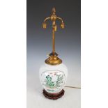 A Chinese porcelain famille verte jar mounted as a three light table lamp, Qing Dynasty, decorated