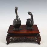 A Japanese bronze figure group of two Chinese geese, Meiji Period, naturalistically modelled