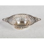 An Edwardian silver twin handled bon bon dish, Birmingham 1906, makers mark of E.S.B., of tapered