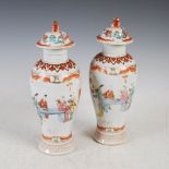 A pair of Chinese porcelain famille rose jars and covers, Qing Dynasty, decorated with continuous