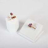 Three rings, comprising; pyrope garnet three stone ring set to yellow metal shank stamped '9ct',