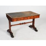 A Regency rosewood and gilt metal mounted library table, the rounded rectangular top with a green