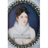 A 19th century portrait miniature of a Lady, painted on oval ivory panel, within a split pearl,