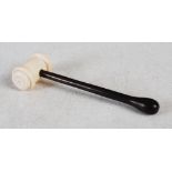 A late 19th century ivory and calamander gavel, with turned ivory head and turned calamander handle,