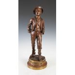 After Marcel Debut, a bronze figure group titled "L'ecolier", on circular plinth base, 55cm high.