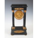 A 19th century French black marble and gilt metal Portico clock, the circular dial with Roman